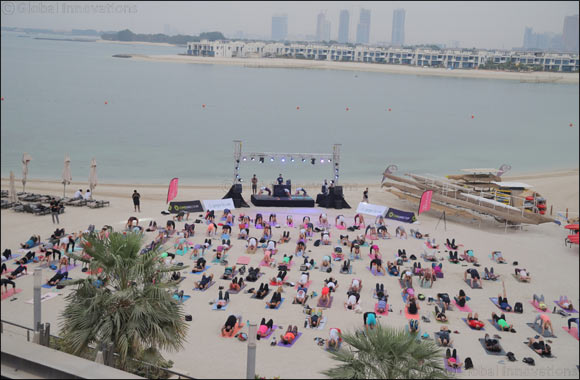 Begin your Dubai Fitness Challenge journey with Club Vista Mare's Core Beats free beach yoga and fitness concert