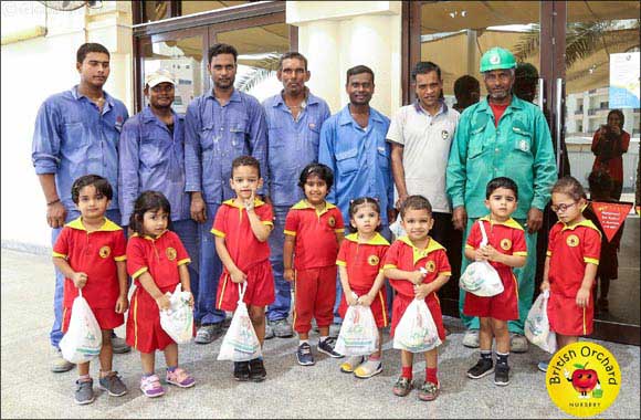 Nursery children gift Eid packages to labourers