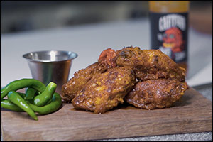 Just Wing It and Win at the Huddle Sports Bar and Grill
