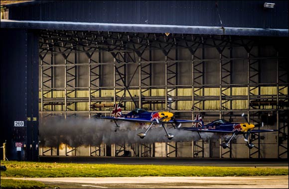 British pilots record world first as they fly in formation through building