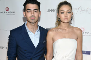 Gigi Hadid, Joe Jonas and Jordan Barrett wear Tommy Hilfiger