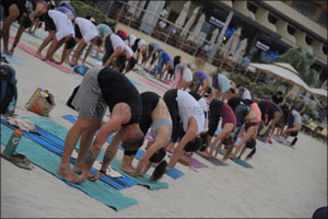 Begin your Dubai Fitness Challenge journey with Club Vista Mare's Core Beats free beach yoga and fitness concert