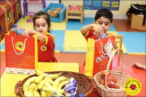 Nursery children gift Eid packages to labourers